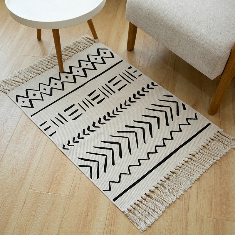 Flat-woven cotton runner with Boho-Ethno motif and decorative fringes