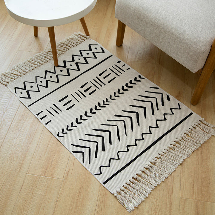Flat-woven cotton runner with Boho-Ethno motif and decorative fringes