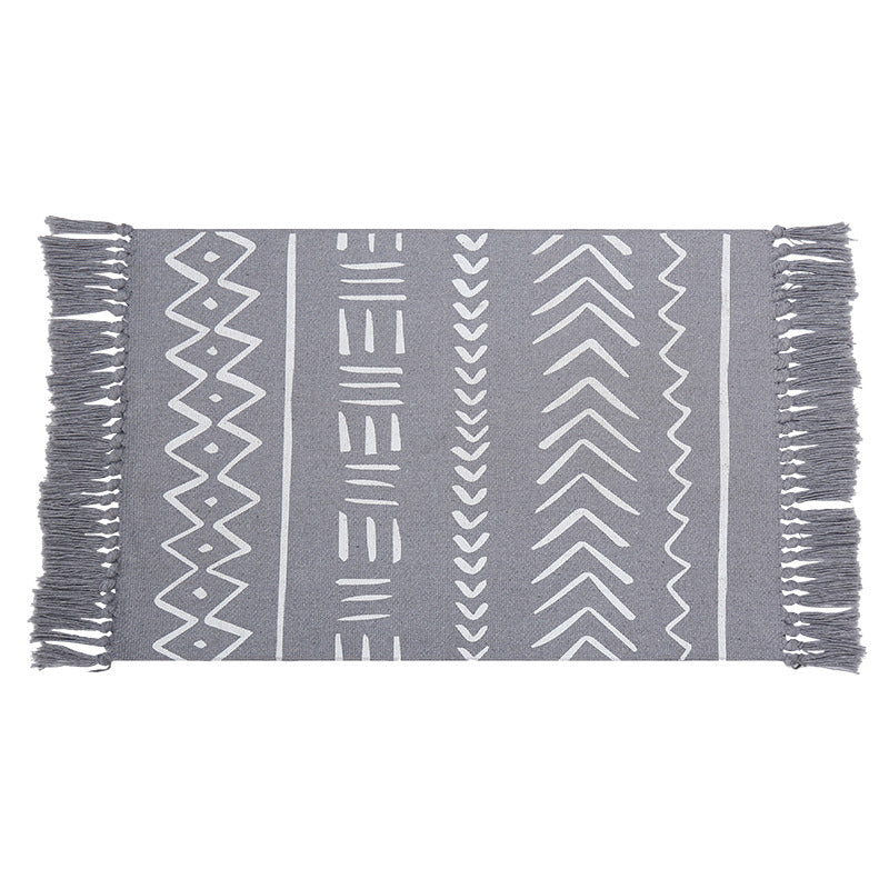 Flat-woven rug runner in Boho Mudcloth design with cotton fringes