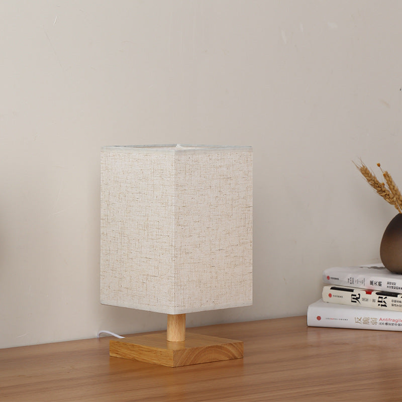 Compact Scandinavian wooden foot table lamp with linen lampshade