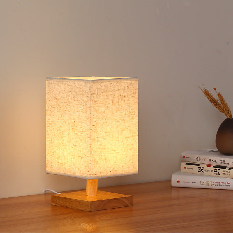 Compact Scandinavian wooden foot table lamp with linen lampshade