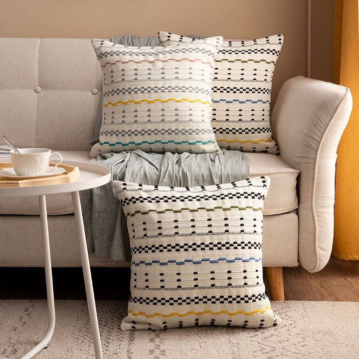 Woven square decorative cushion cover with decorative embroidered stripes made of cotton blend