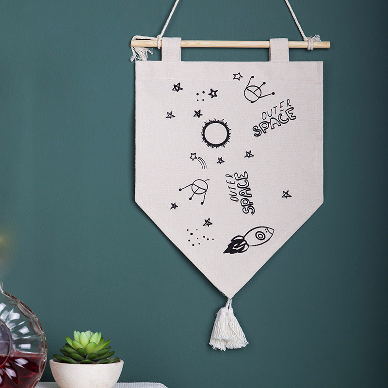 Decorative cotton wall hanging in pennant style with tassels and minimalist prints