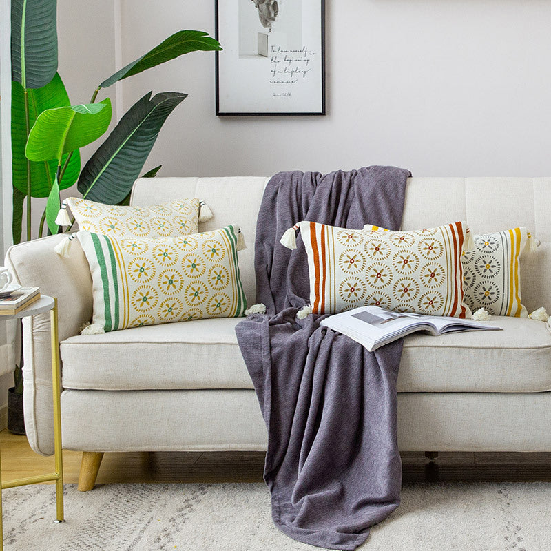 Decorative cushion cover with woven medallion pattern and tassels