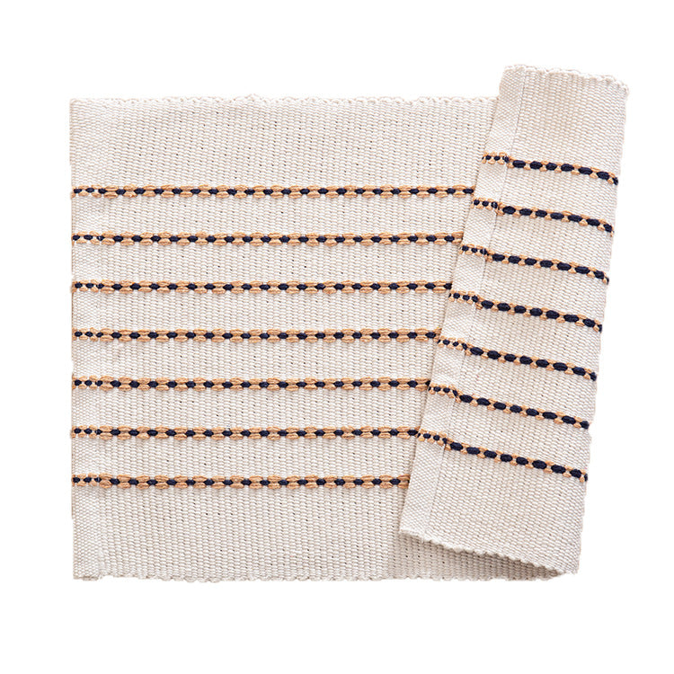 Woven placemats and table runners made of cotton blend with fine dot stripes and knot applications