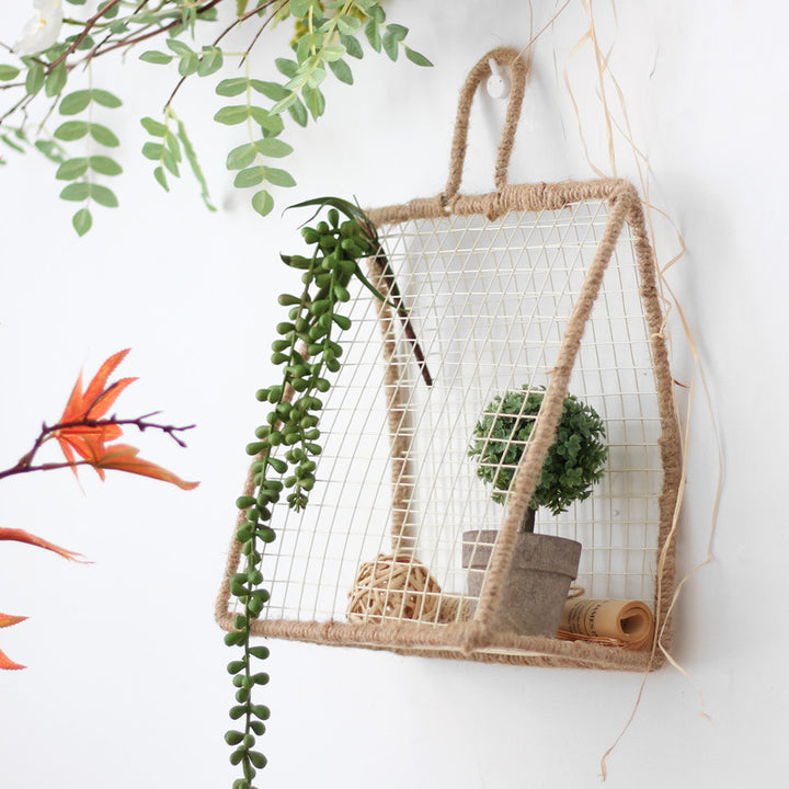 Decorative plant holder made of wire and natural fiber
