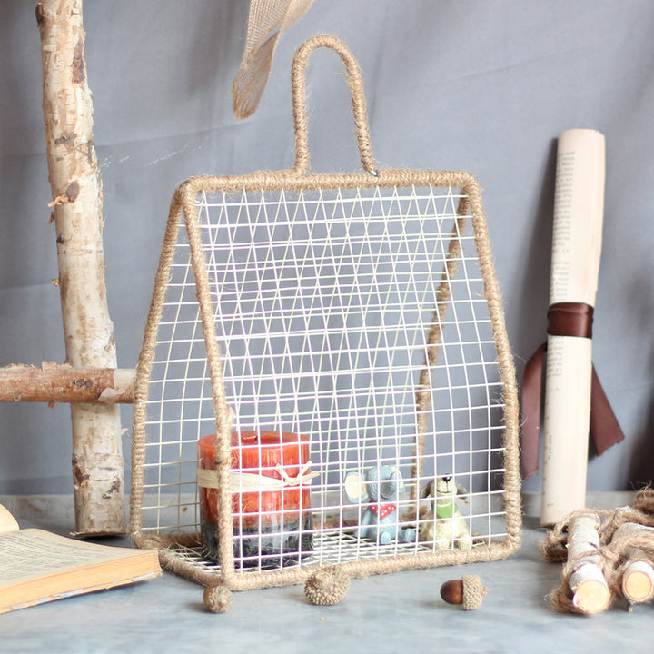 Decorative plant holder made of wire and natural fiber