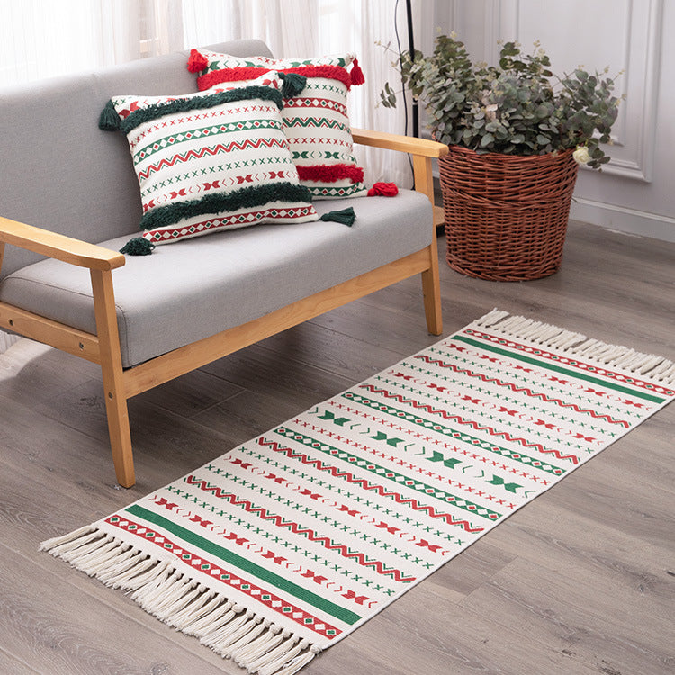 Flat-woven runner rug with Nordic Christmas pattern, tassels and cotton blend