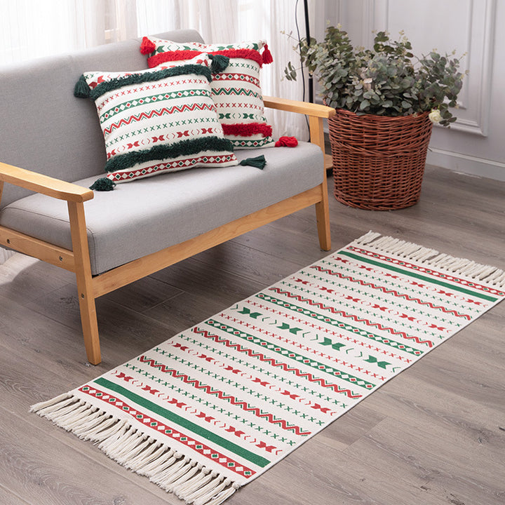 Flat-woven runner rug with Nordic Christmas pattern, tassels and cotton blend