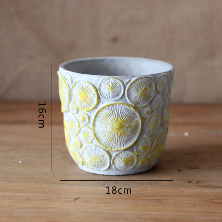 Decorative flower vase made of ceramic with relief structure