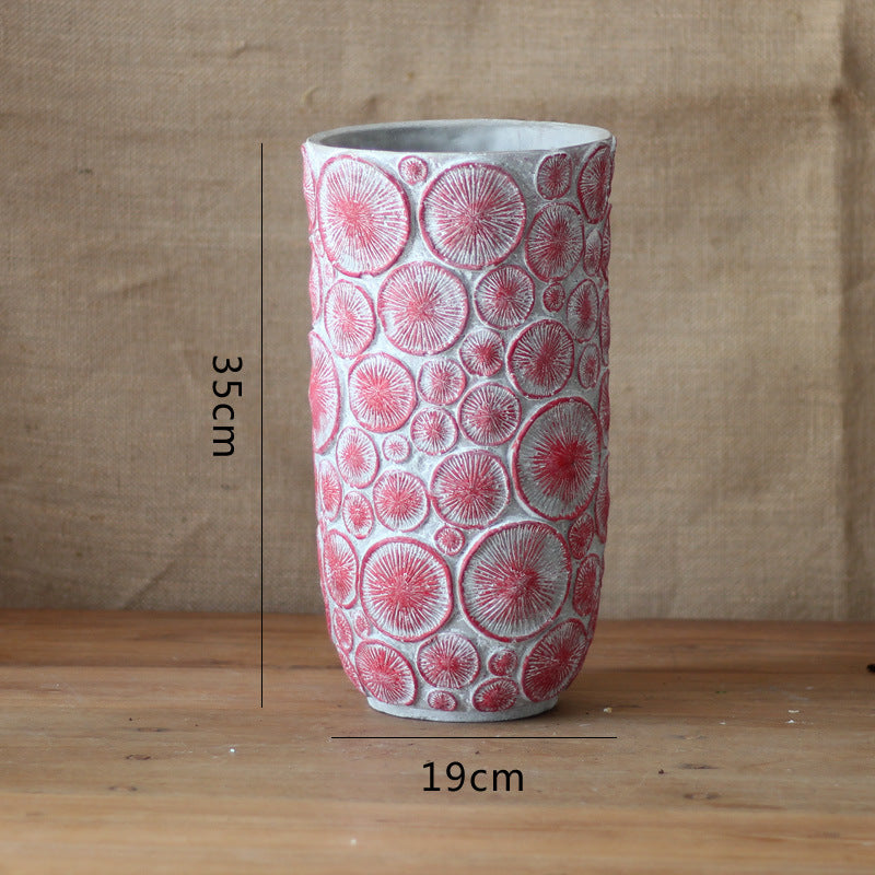 Decorative flower vase made of ceramic with relief structure