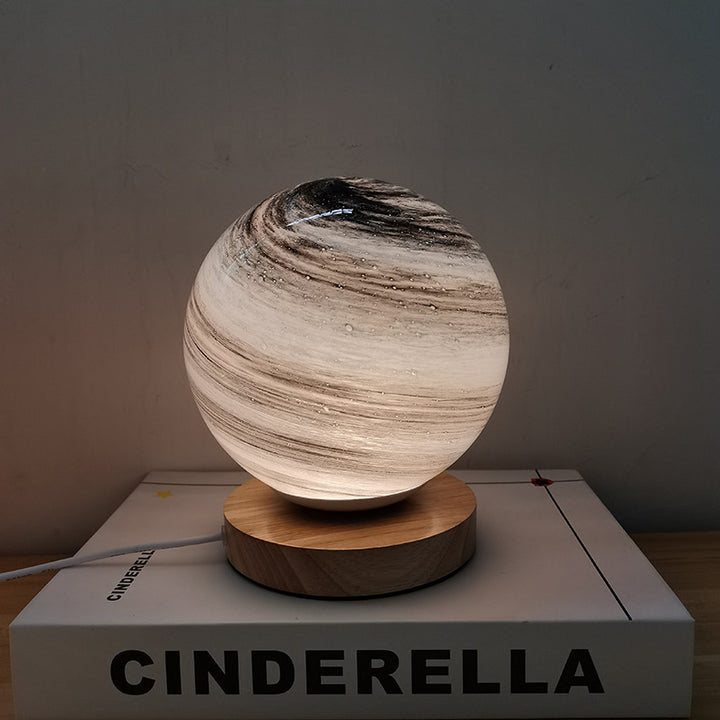 Marbled orb table lamp with wooden base