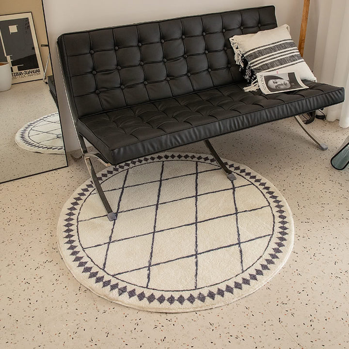 Round living room rug with graphic diamond pattern and soft short pile