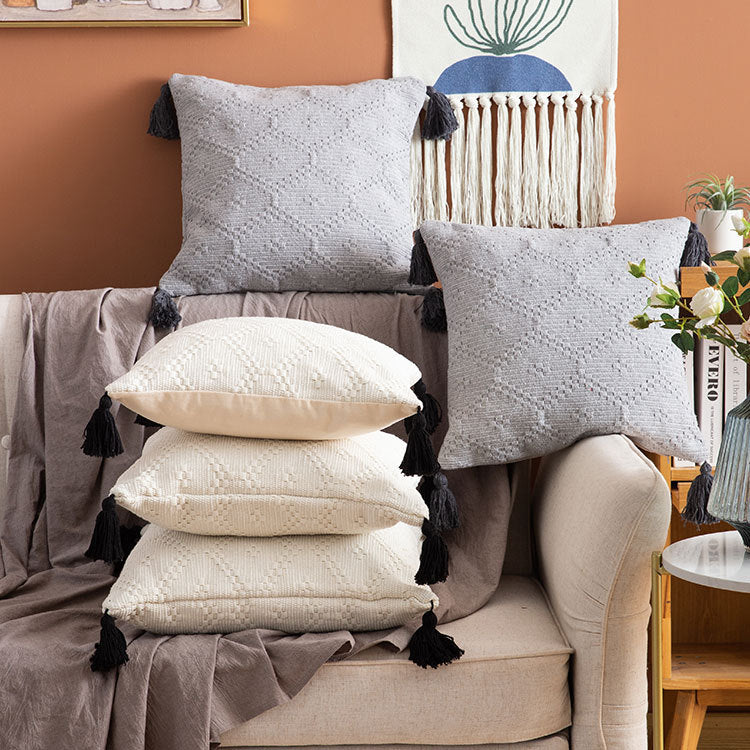 Square Boho cushion cover made of handwoven cotton with textured relief weaving and four tassels