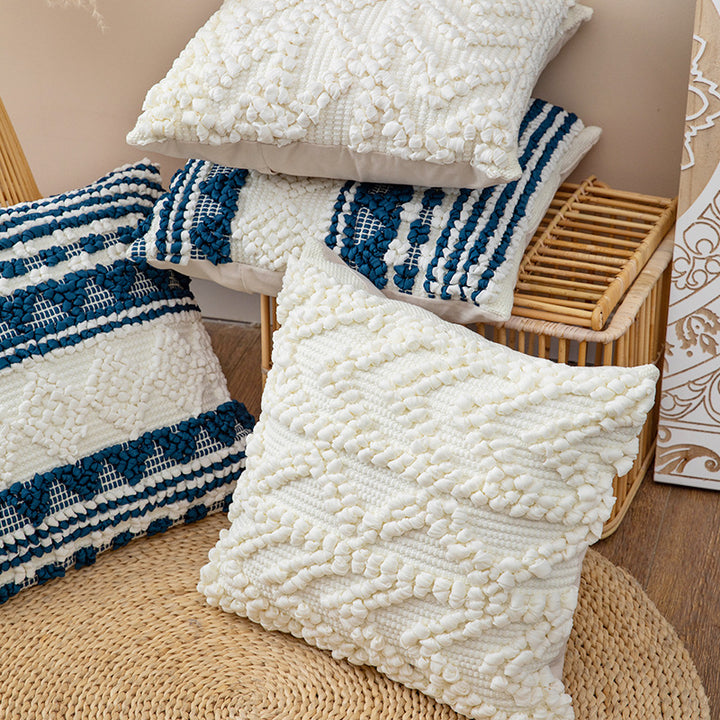 Square woven decorative cushion cover with crocheted appliqués and textured relief