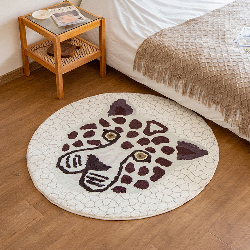 Round living room rug with graphic diamond pattern and soft short pile