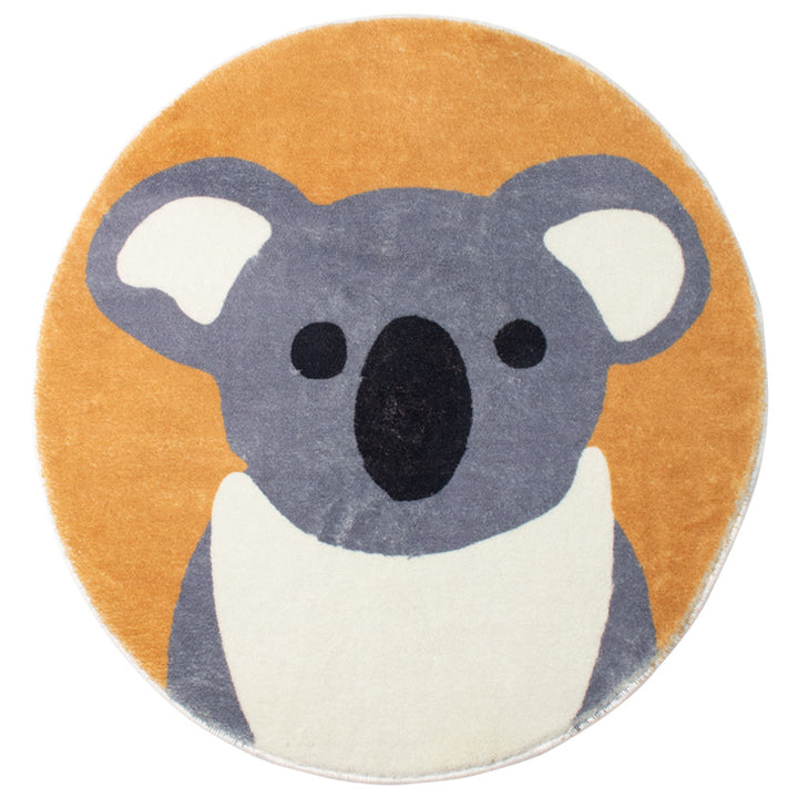Round living room rug with graphic diamond pattern and soft short pile