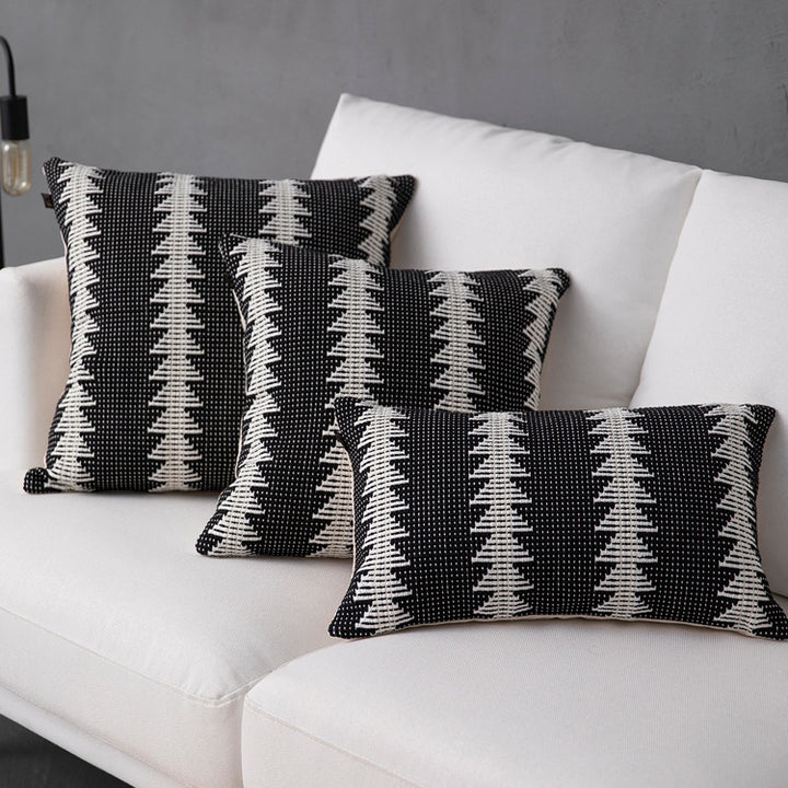 Decorative woven cushion cover with ethnic jacquard, tassels and concealed zipper