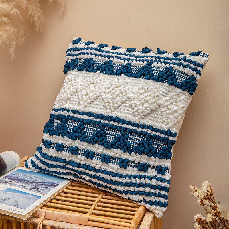 Square woven decorative cushion cover with crocheted appliqués and textured relief