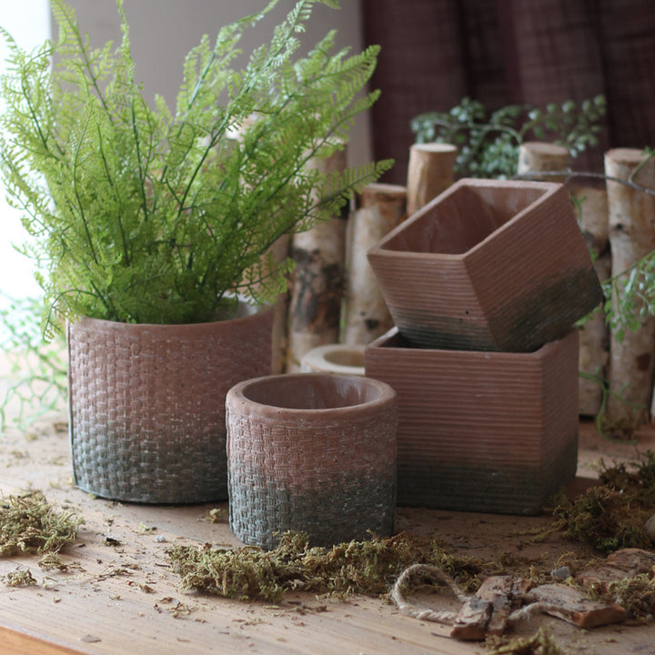 Decorative flower pot with woven design