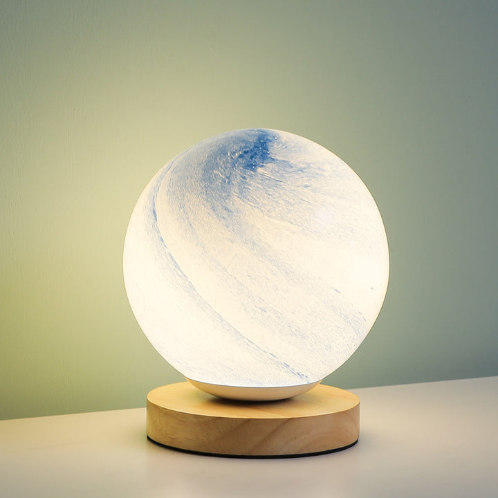 Marbled orb table lamp with wooden base