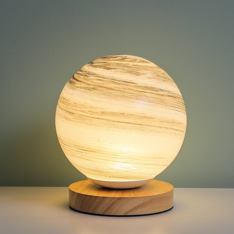 Marbled orb table lamp with wooden base