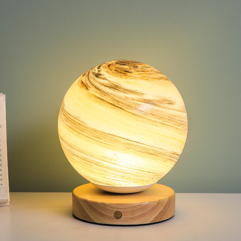 Marbled orb table lamp with wooden base