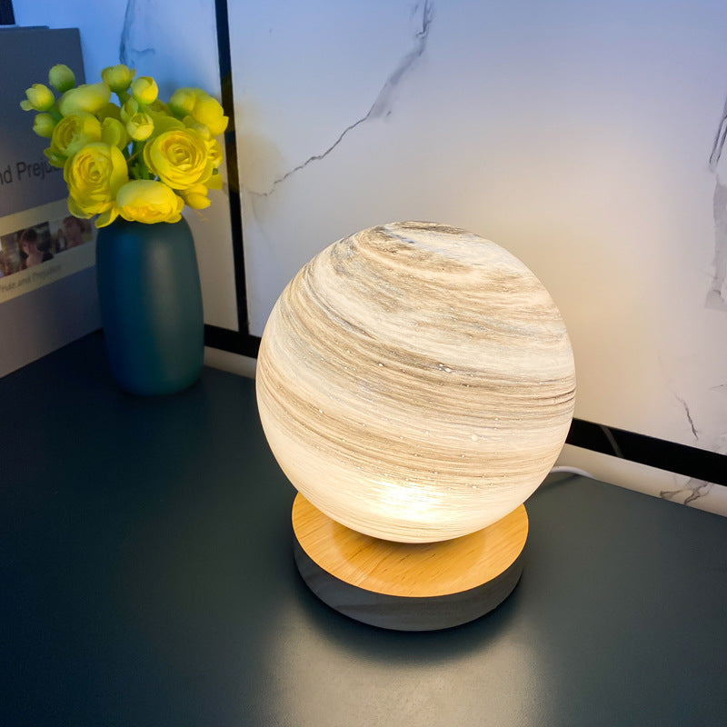 Marbled orb table lamp with wooden base