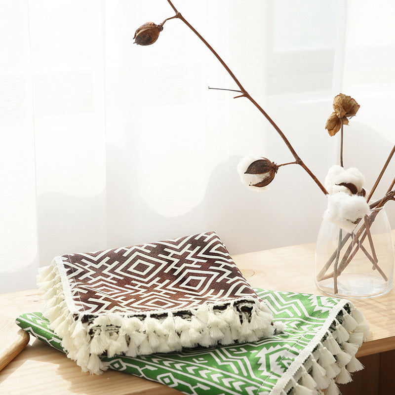 Woven cotton tablecloth with ethnic jacquard pattern and tassel trim