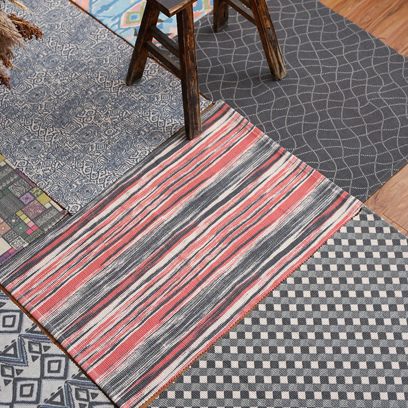 Patchwork runner made of flat-woven cotton blend with graphic stripe and checkered fields