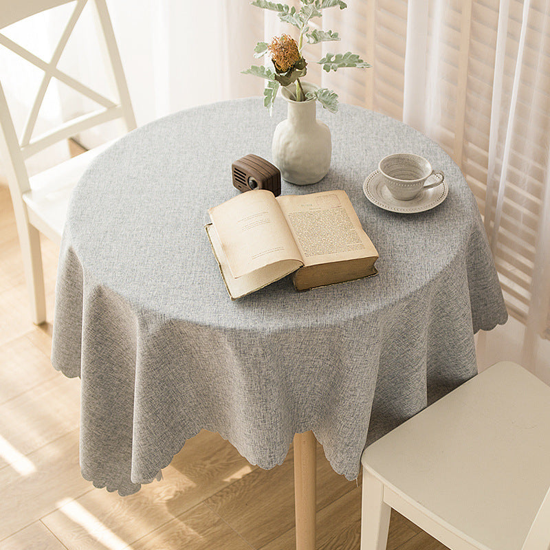 Rectangular tablecloth in linen look with wavy arc edge