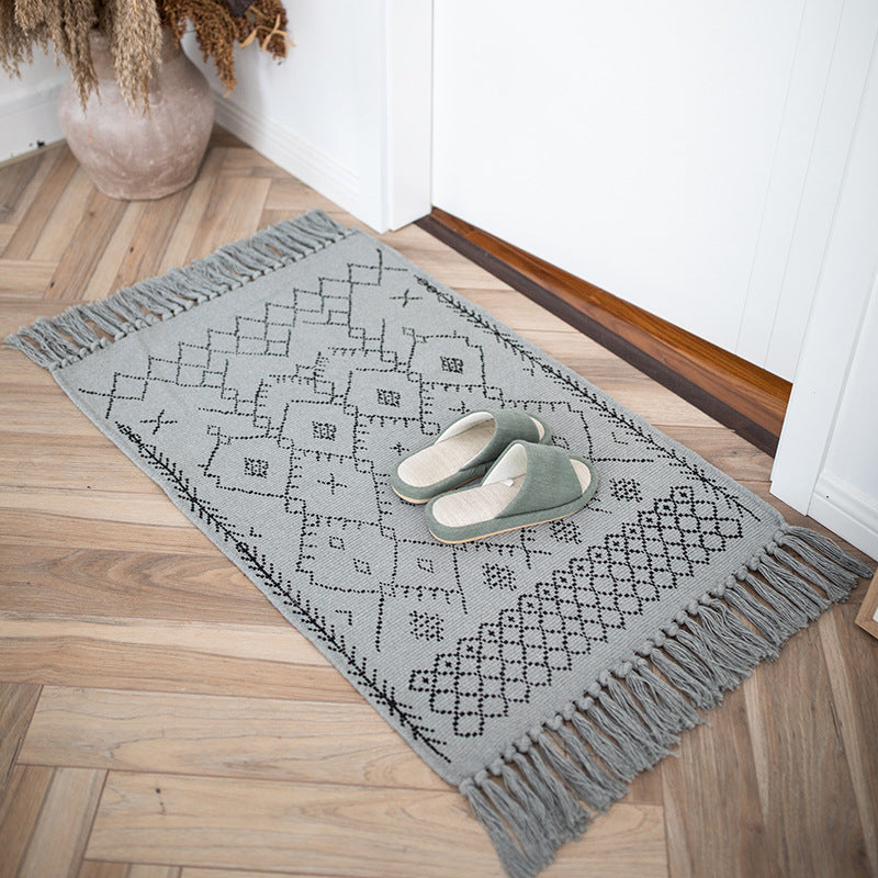 Woven cotton rug runner with flat weave structure, graphic diamond ethnic pattern and fringes