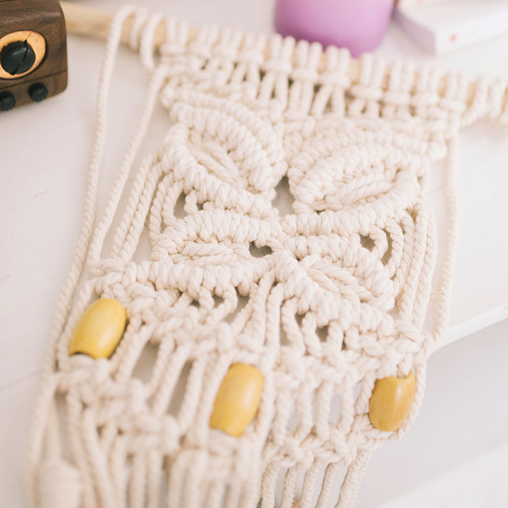 Macrame phone pouch with wooden beads, leaf relief and hanging loop