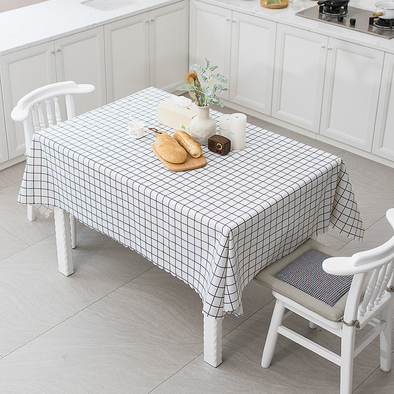 Wipeable tablecloth with fine check pattern, wavy hem and easy-care PVC finish