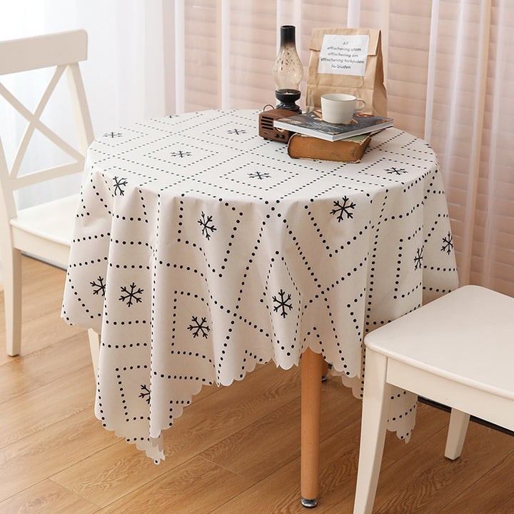 Wipeable tablecloth with fine check pattern, wavy hem and easy-care PVC finish