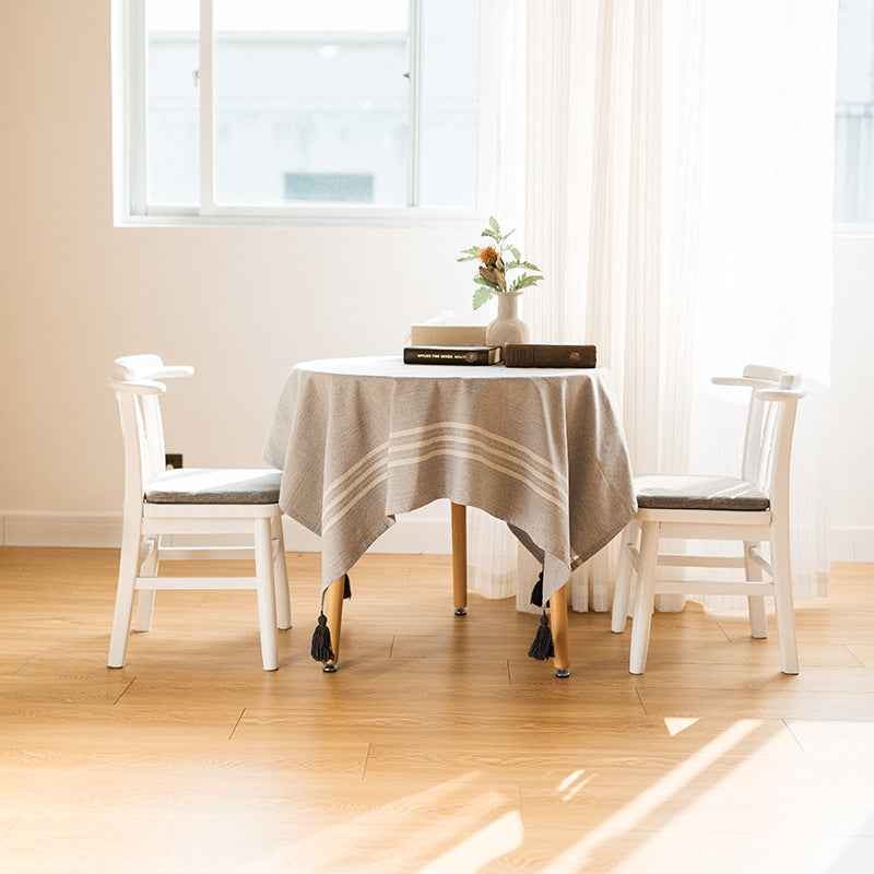 Rectangular linen look tablecloth with fringed tassels and side stripe border design