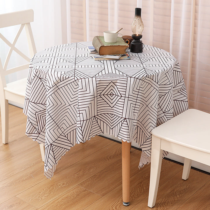 Wipeable tablecloth with fine check pattern, wavy hem and easy-care PVC finish