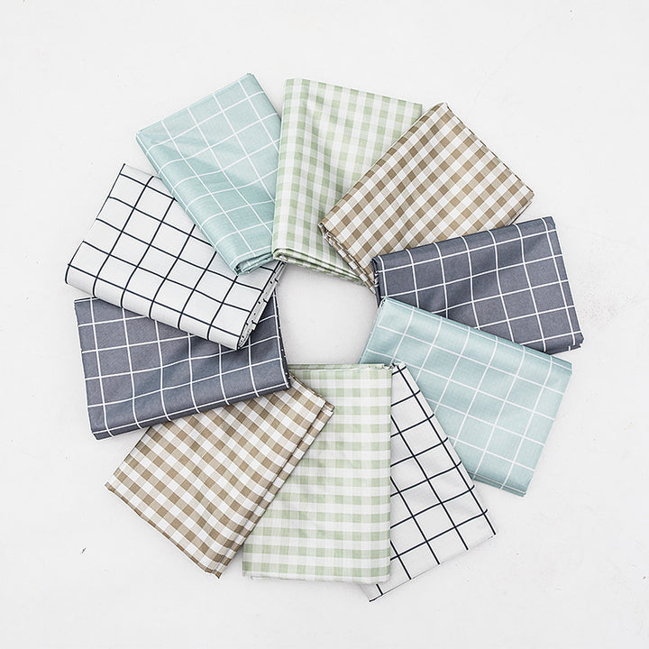 Wipeable tablecloth with fine check pattern, wavy hem and easy-care PVC finish