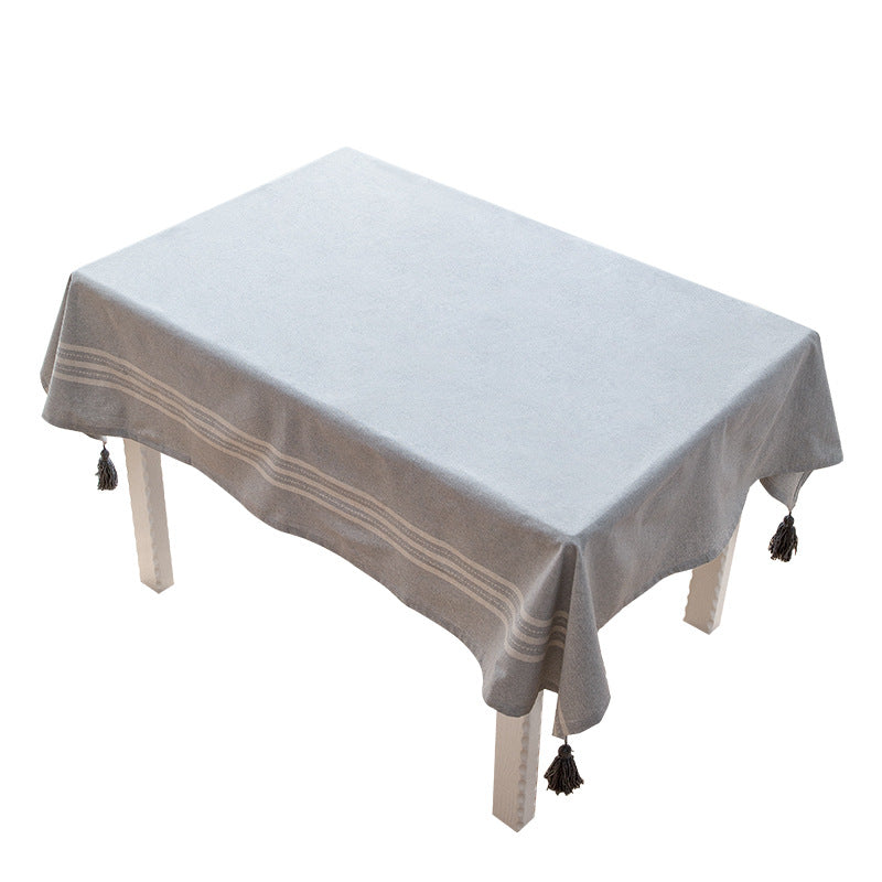 Rectangular linen look tablecloth with fringed tassels and side stripe border design