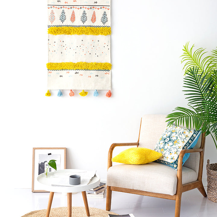 Wall tapestry in Scandi-Boho style with tufting stripes, tassels, and wooden rod