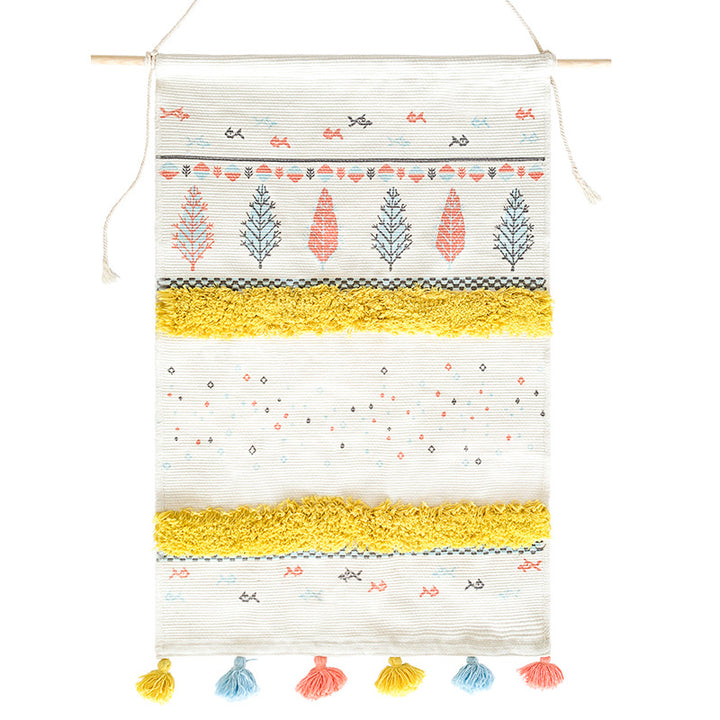 Wall tapestry in Scandi-Boho style with tufting stripes, tassels, and wooden rod