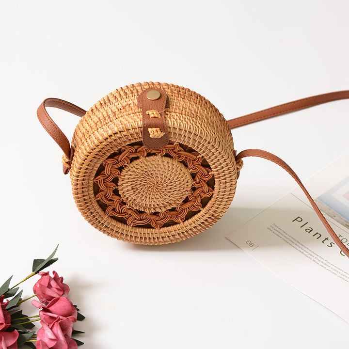 Elegant round handbag made of woven rattan
