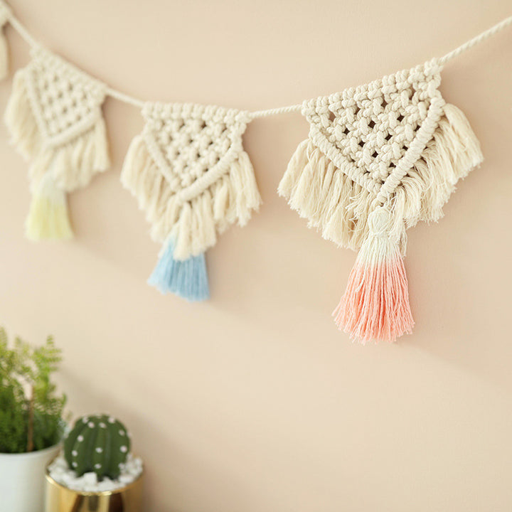 Macrame pennant string with hand-knotted triangle elements and tassels