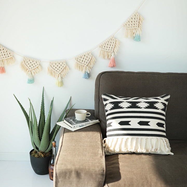 Macrame pennant string with hand-knotted triangle elements and tassels