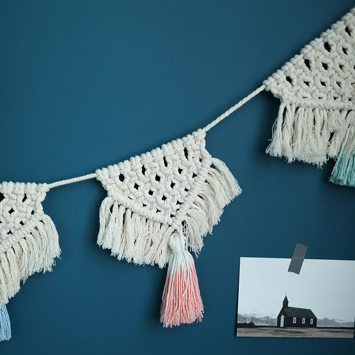 Macrame pennant string with hand-knotted triangle elements and tassels