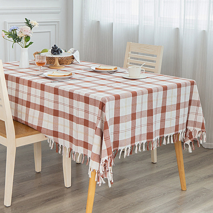 Rectangular checked cotton tablecloth with decorative fringes and light linen finish