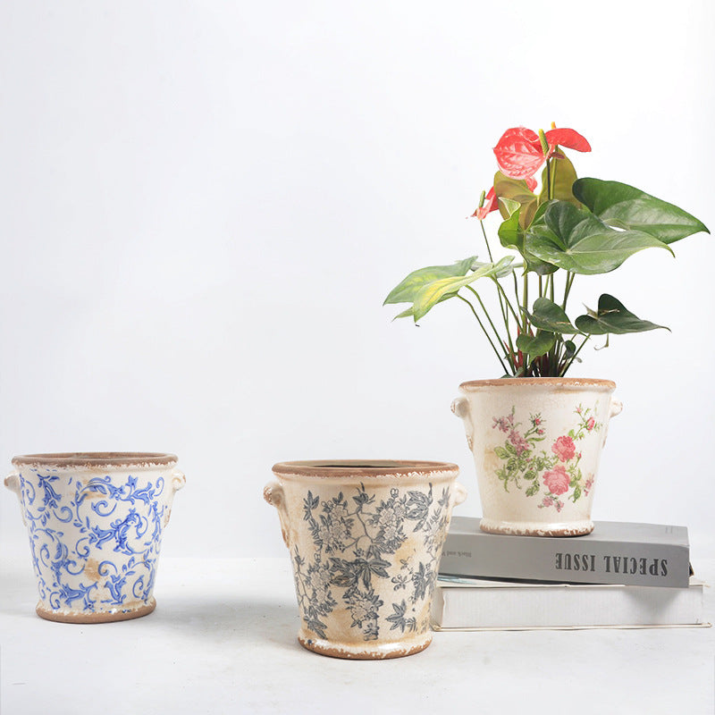 Decorative flower pot with floral embellishments