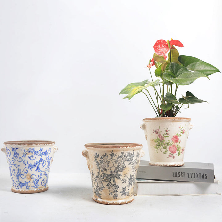 Decorative flower pot with floral embellishments