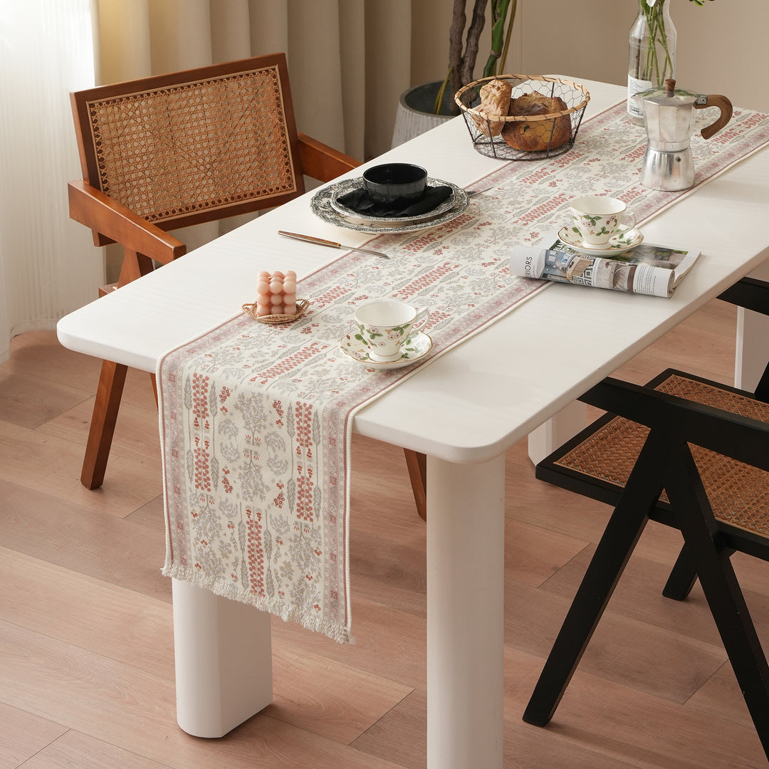 Woven jacquard table runner with floral medallion and fringes