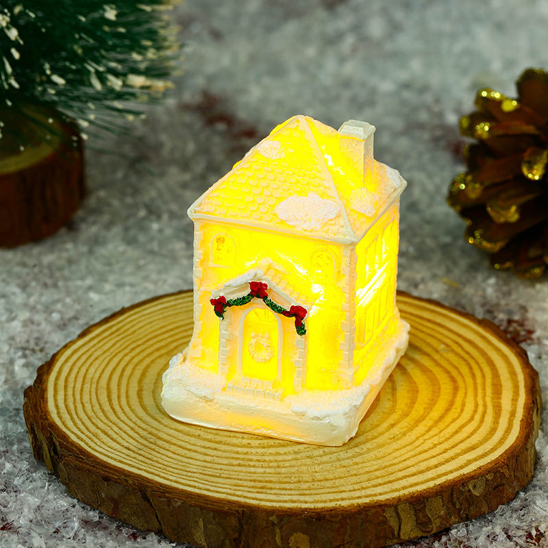 Illuminated Christmas village house with festive decoration